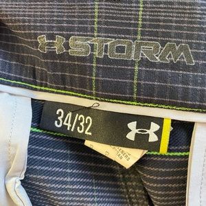 UnderArmour Storm golf pants  black with grey and green stripes.